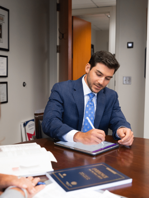 | Kevin Biniazan Chosen as an “Up & Coming” Attorney Attorney Kevin Biniazan working on a civil lawsuit in Virginia Beach, VA